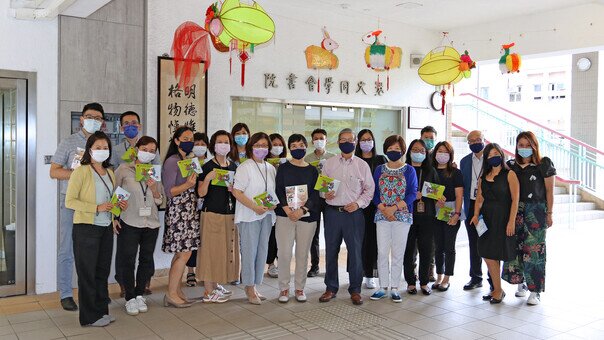 Dr. Kenneth Tse, Chairman of the Foundation, and two school Supervisors distribute the reusable face masks to College staff