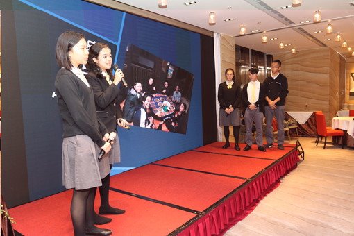 Students of College sharing exploration experiences in Myanmar with participants at AGM dinner