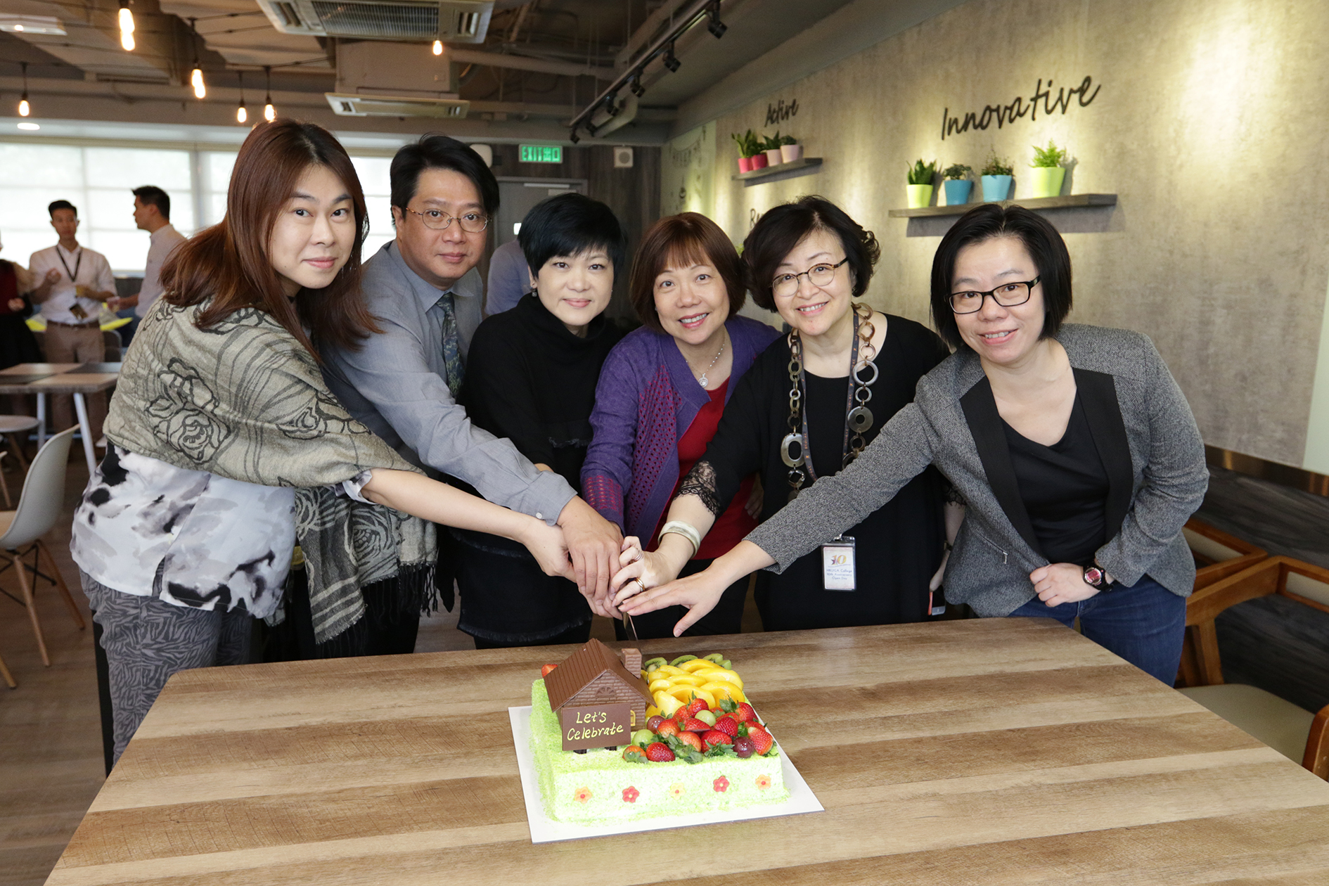 Cake cutting ceremony: (from the left) Ms. Monitor Lor, Mr. Newman Chan, Ms. Kandy Chau, Mrs. Fanny Lam, Ms. Corina Chen and Ms. Ruby Lam.