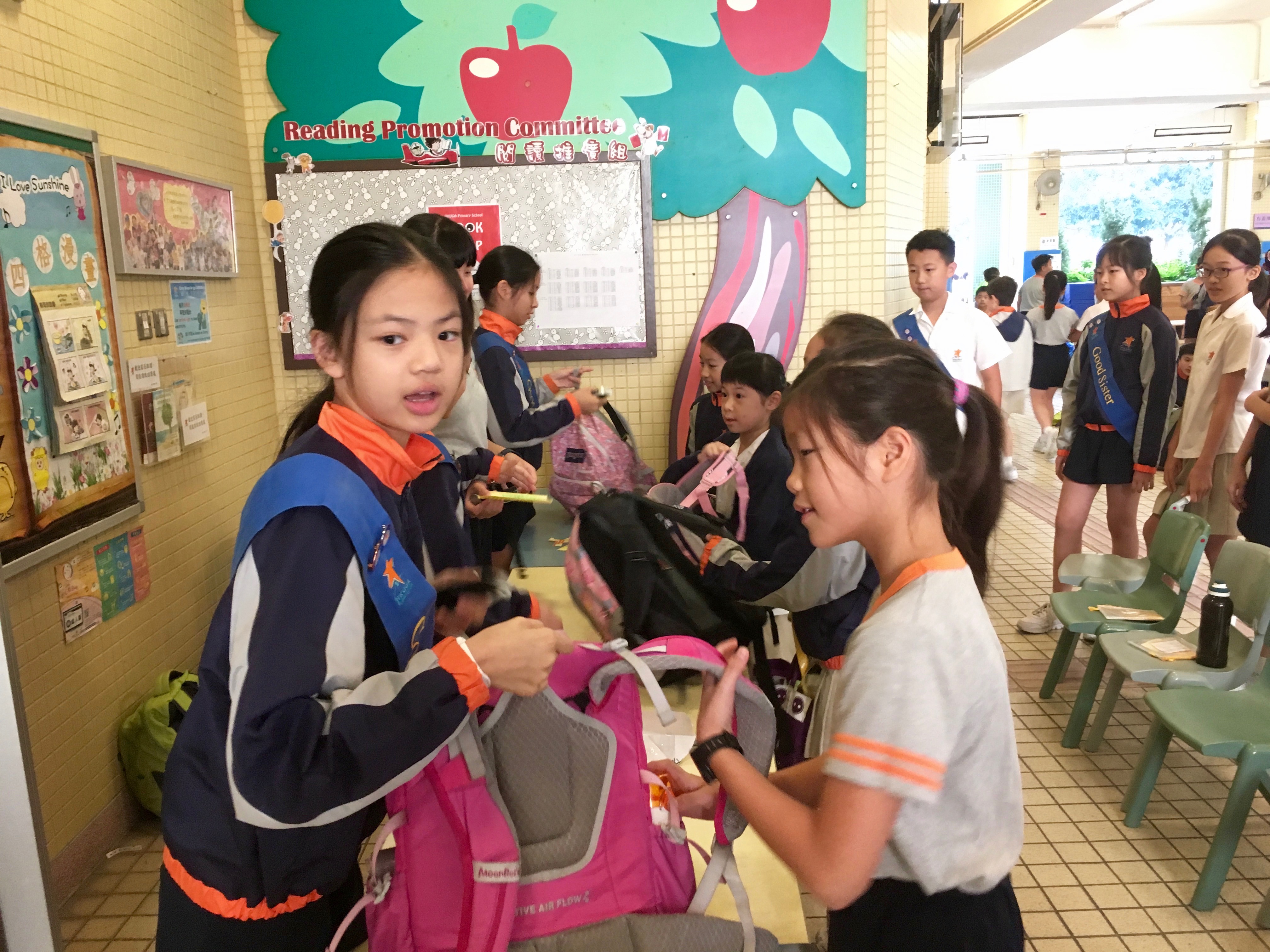 Our Good Brothers and Good Sisters helped us weigh our backpacks.