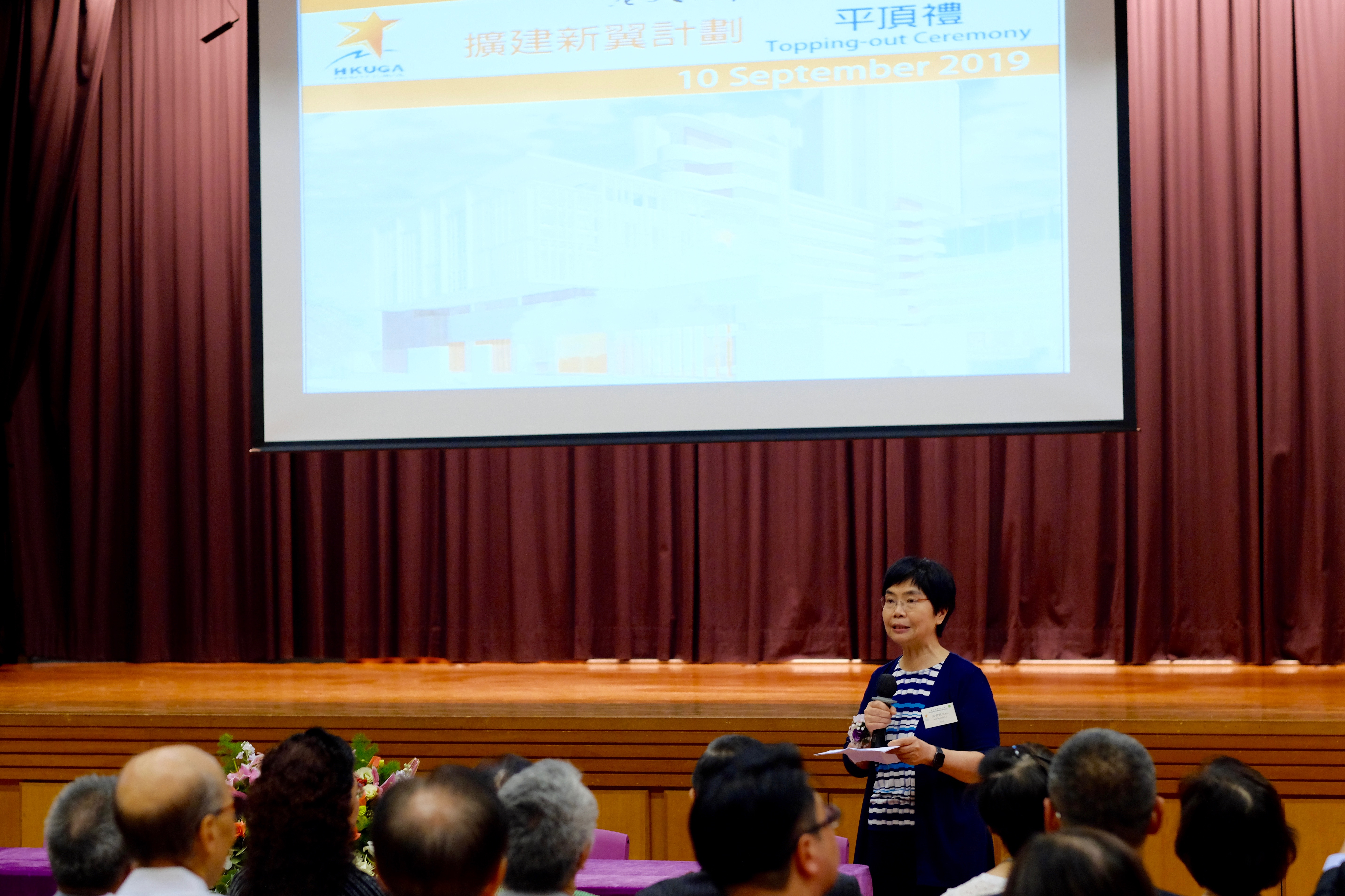 Dr. LO, the supervisor, delivers remarks at the topping-out ceremony